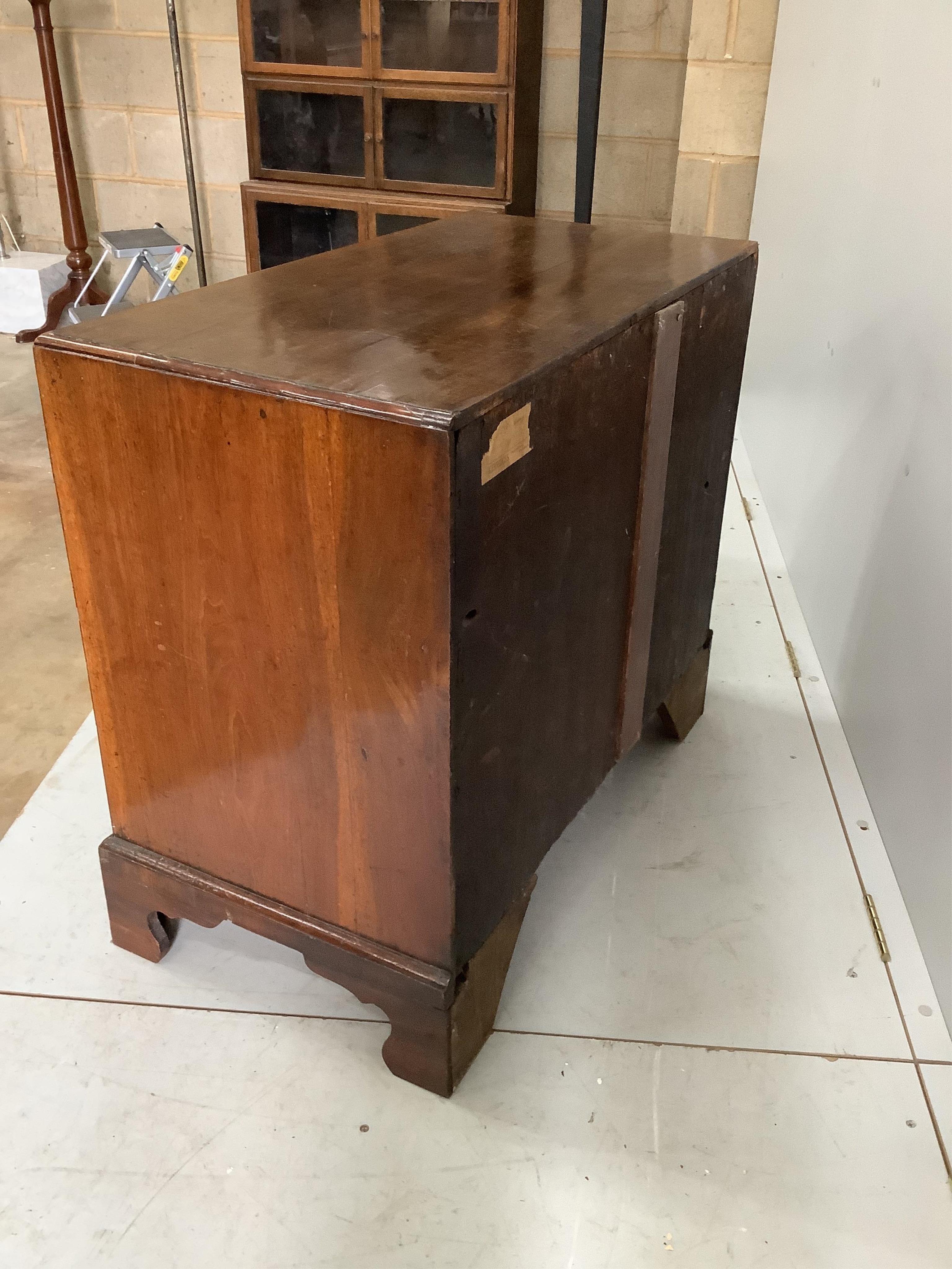 A George III mahogany kneehole desk, width 83cm, depth 44cm, height 76cm. Condition - fair